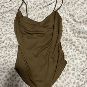 Brown body suit swoop chest.